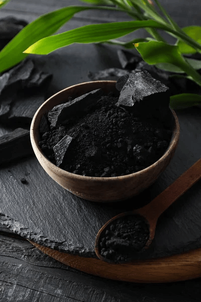 stock-photo-natural-charcoal-powdered-charcoal-dark-wooden-background.jpg